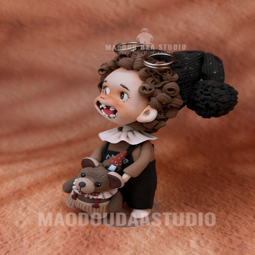 Cute baby with braces hand-sculpted figurine – front view with double buns and round glasses