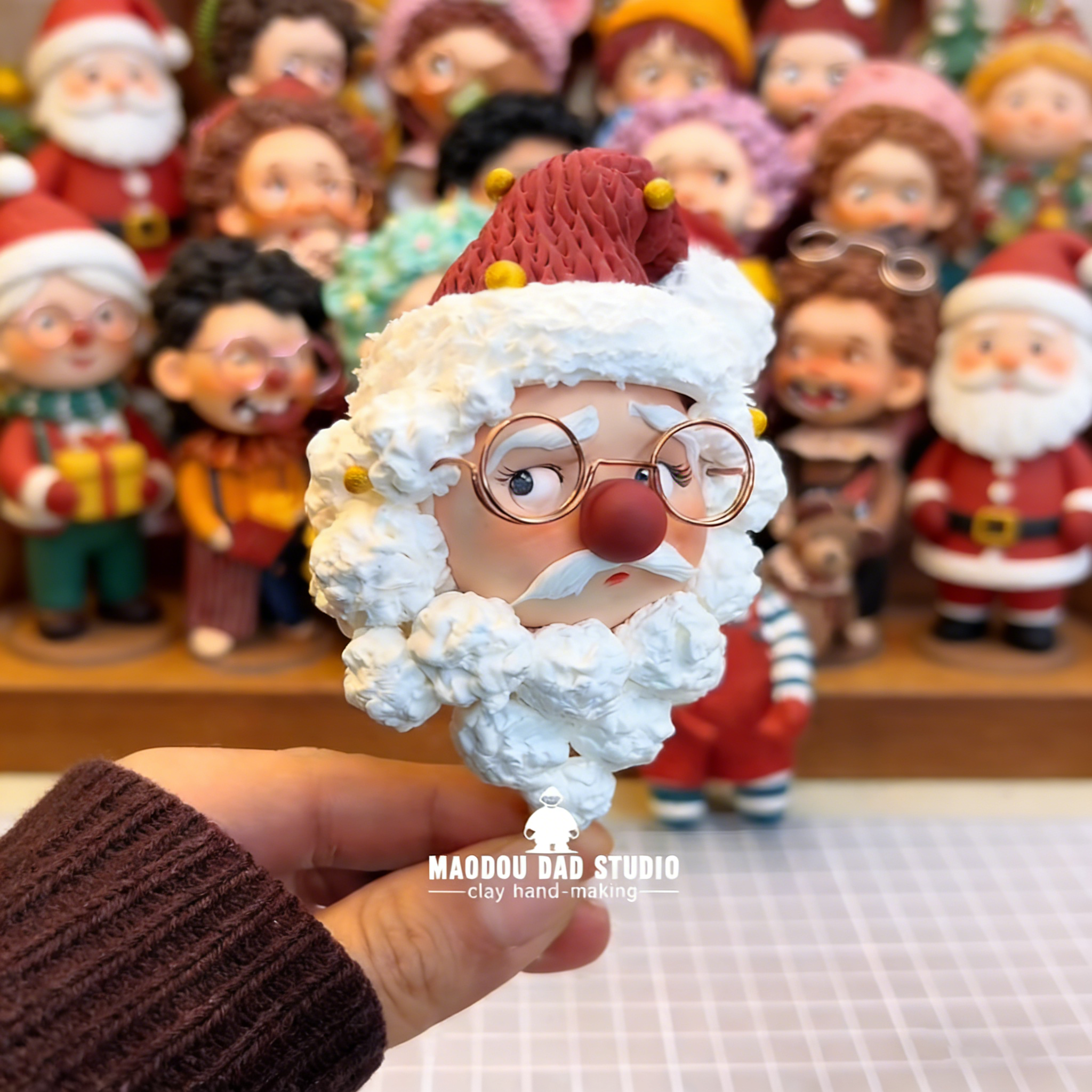 Hand-sculpted Santa figurine on clear display base – holiday desk decor